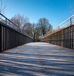 View of footbridge against clear sky