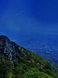 Scenic view of landscape against blue sky