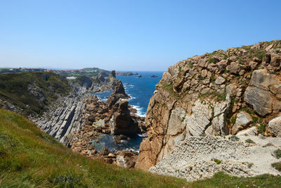 A beautiful view of whimsical rock formations on cliffs in northern spain.