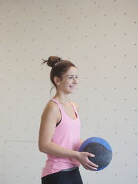 Confident woman exercising at gym