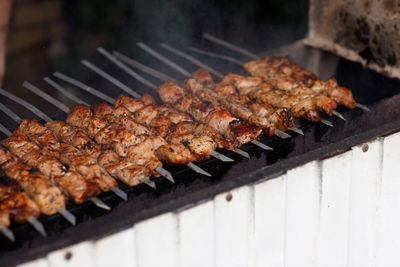 Close-up of meat on barbecue grill