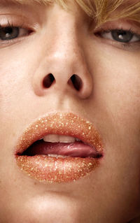 Close-up portrait of woman wearing lipstick