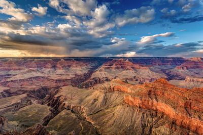 Sunset with stormy clouds sweeping across the vast landscape at the grand canyon