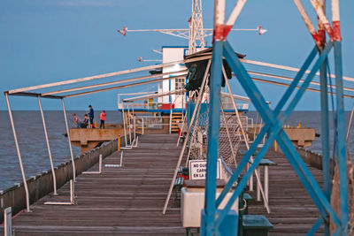 Pier over sea against sky