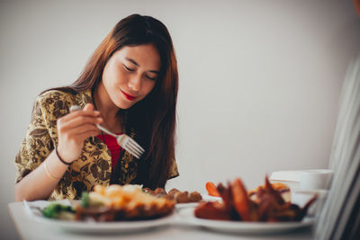 Young woman looking away in plate