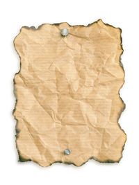 Full frame shot of leaf on white paper