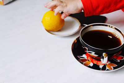 Cropped image of person preparing food on table