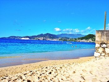 Scenic view of sea against blue sky