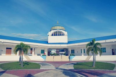 Facade of building against clear blue sky