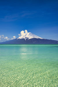 Mount fuji and coral reef sea with composite photo