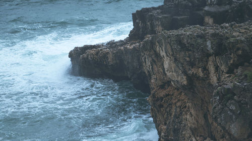 Scenic view of rocks in sea