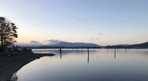 Scenic view of lake against sky during sunset