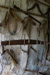 Old rusty metal hanging against wall