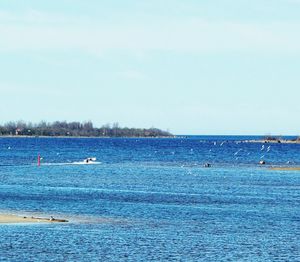 Scenic view of sea against blue sky