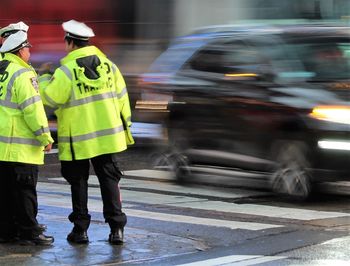 Traffic cops standing on street