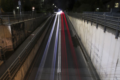 High angle view of light trails on bridge in city