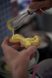 Midsection of person holding cookies