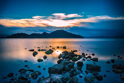 Scenic view of sea against sky at sunset