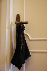 Clothes hanging on door at home