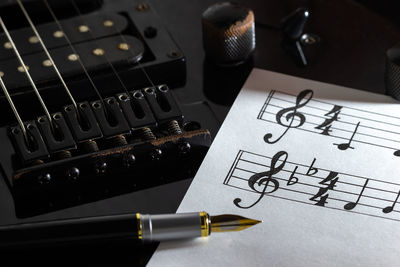 High angle view of guitar on table