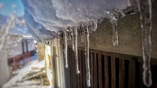 Close-up of snow on mountain against sky