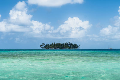Scenic view of sea against blue sky