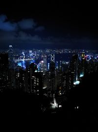 High angle view of illuminated buildings against sky at night