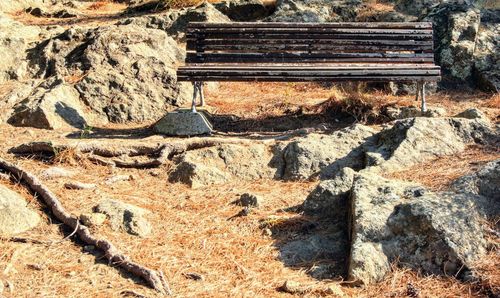 High angle view of bench on field