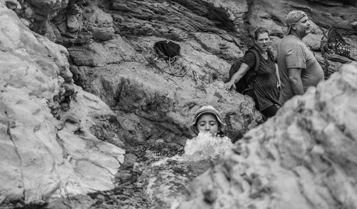 Low angle view of girl on rock