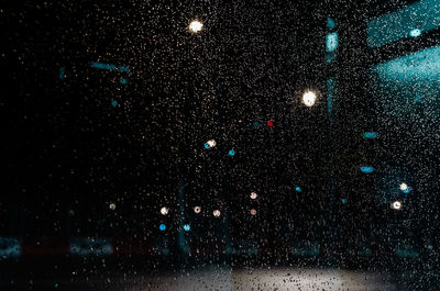 View of sky seen through wet glass window