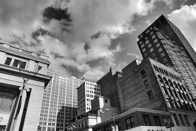 Low angle view of tall buildings against sky