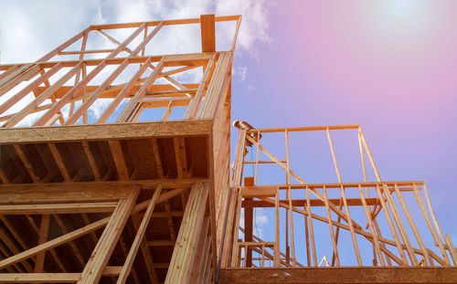 Low angle view of construction crane against sky