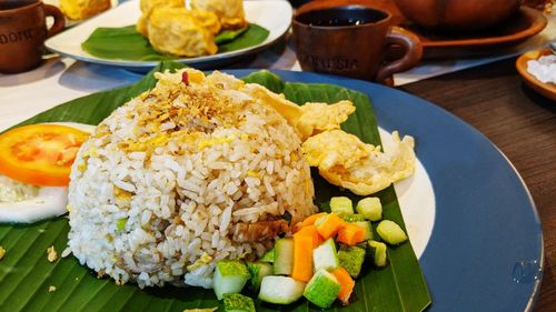 Close-up of indonesia fried rice in plate on table