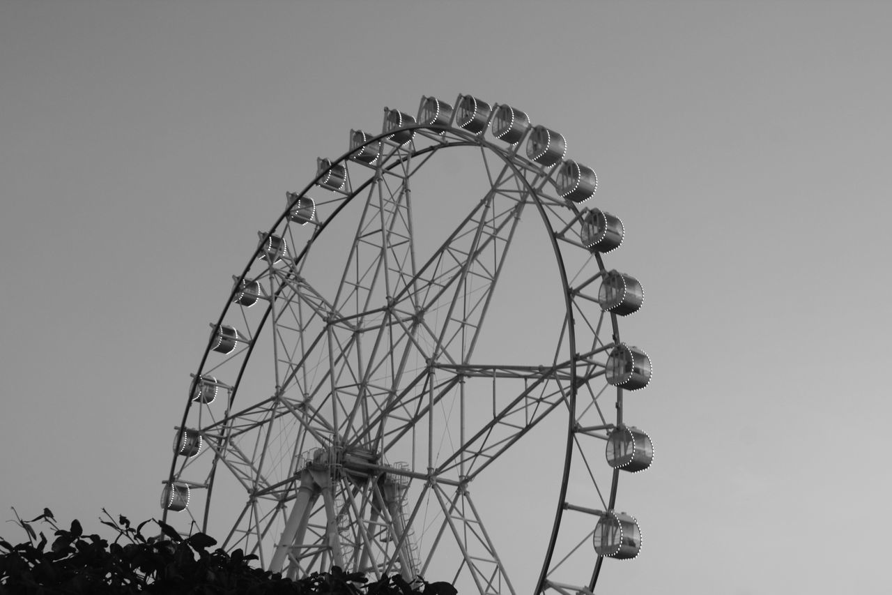 amusement park, arts culture and entertainment, amusement park ride, fairground ride, ferris wheel, fairground, clear sky, low angle view, leisure activity, big wheel, outdoors, day, sky, no people