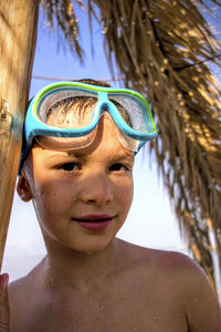 Close-up portrait of a boy in sunglasses