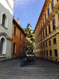 Footpath in front of cathedral against clear sky