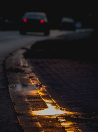 Close-up of wet car on street