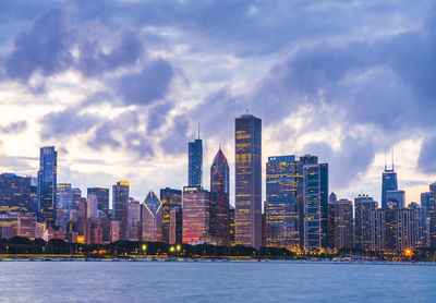 View of buildings against cloudy sky