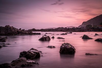 Scenic view of sea against sky at sunset