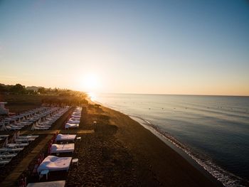 High angle view of beach against sky during sunset