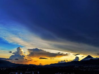 Scenic view of silhouette mountains against sky at sunset