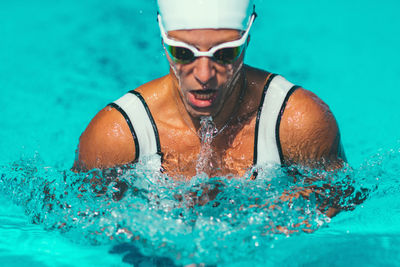 Female athlete swimming in pool