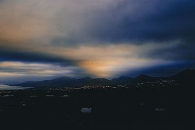 Scenic view of silhouette mountains against sky during sunset