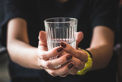 Close-up of hand holding drink