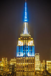 Illuminated buildings in city at night