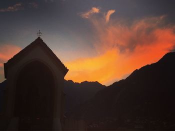 Silhouette temple against sky during sunset