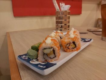 Close-up of sushi served on table