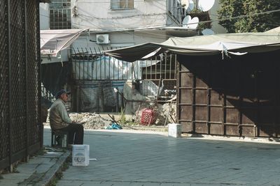 Man in front of building