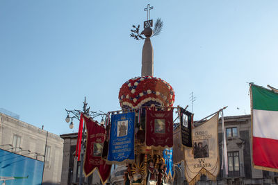 Low angle view of amusement park ride against sky