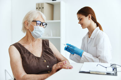 Midsection of woman holding hands